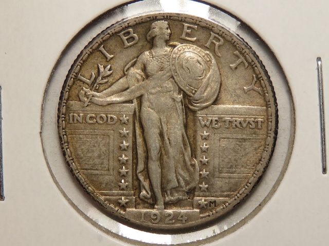 1924 Standing Liberty quarter off-center strike error showing crescent blank area on coin edge with readable 1924 date still visible